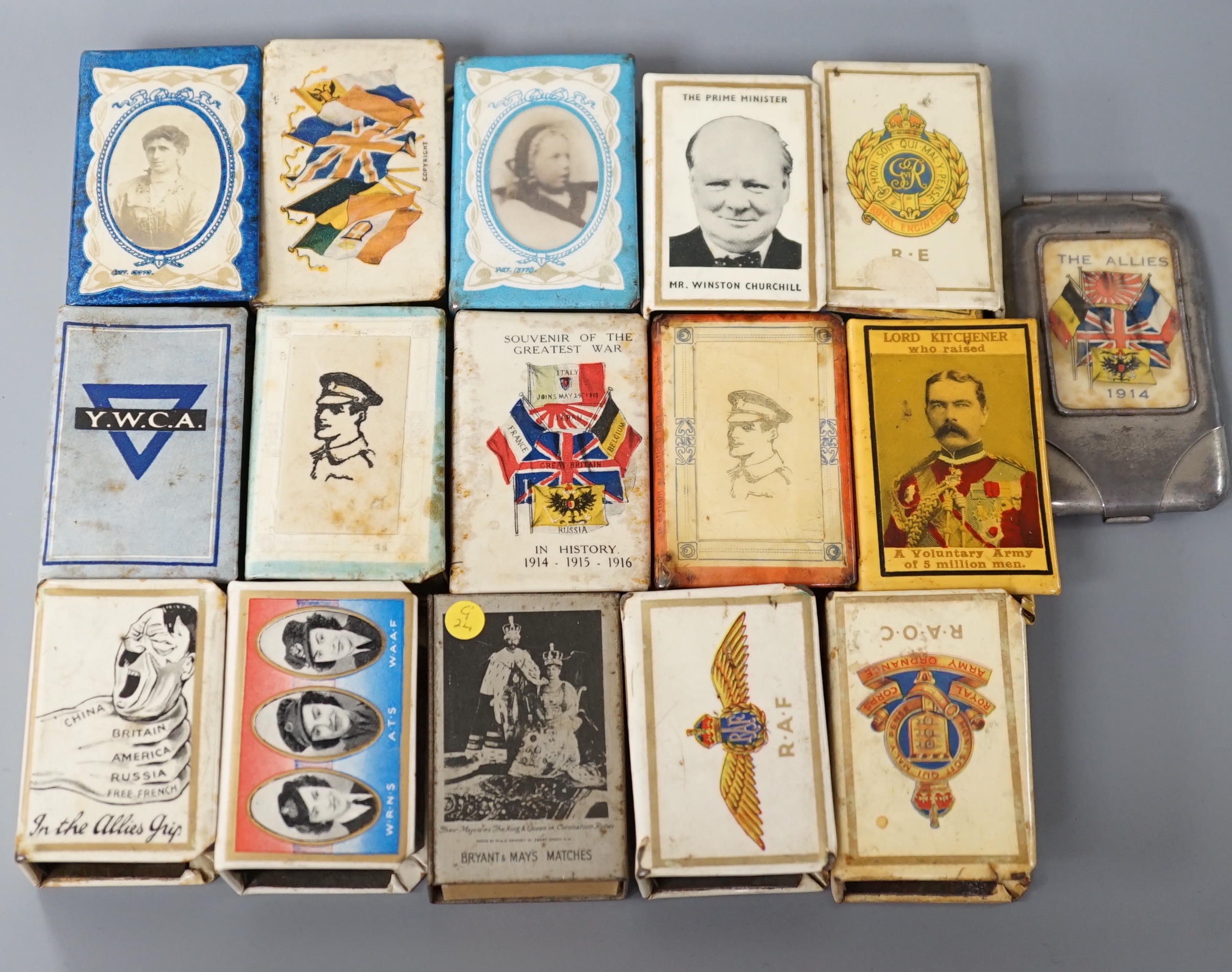 A collection of early and mid 20th century WWII match box holders